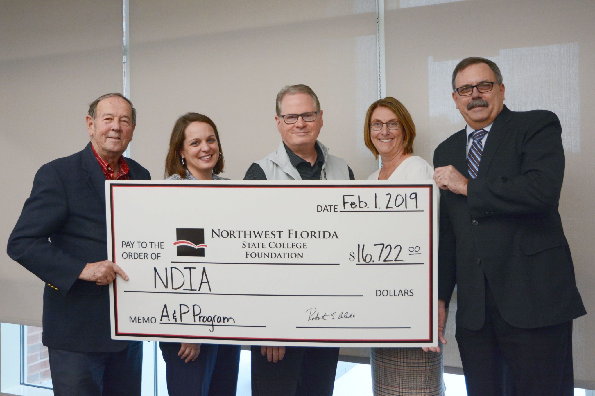 National Defense Industry Association presents a check to the Northwest Florida State College Foundation