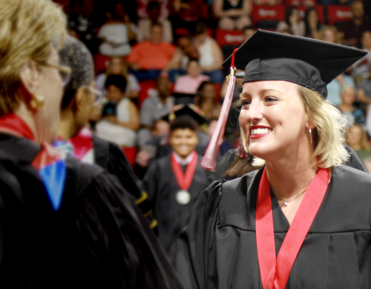 Student receiving their diploma at NWF State College Commencement